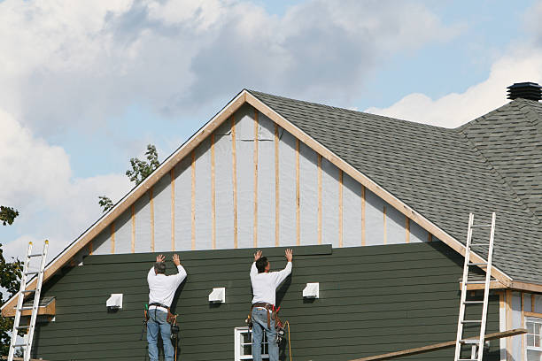 Professional Siding Replacement technician working in Revere, MA